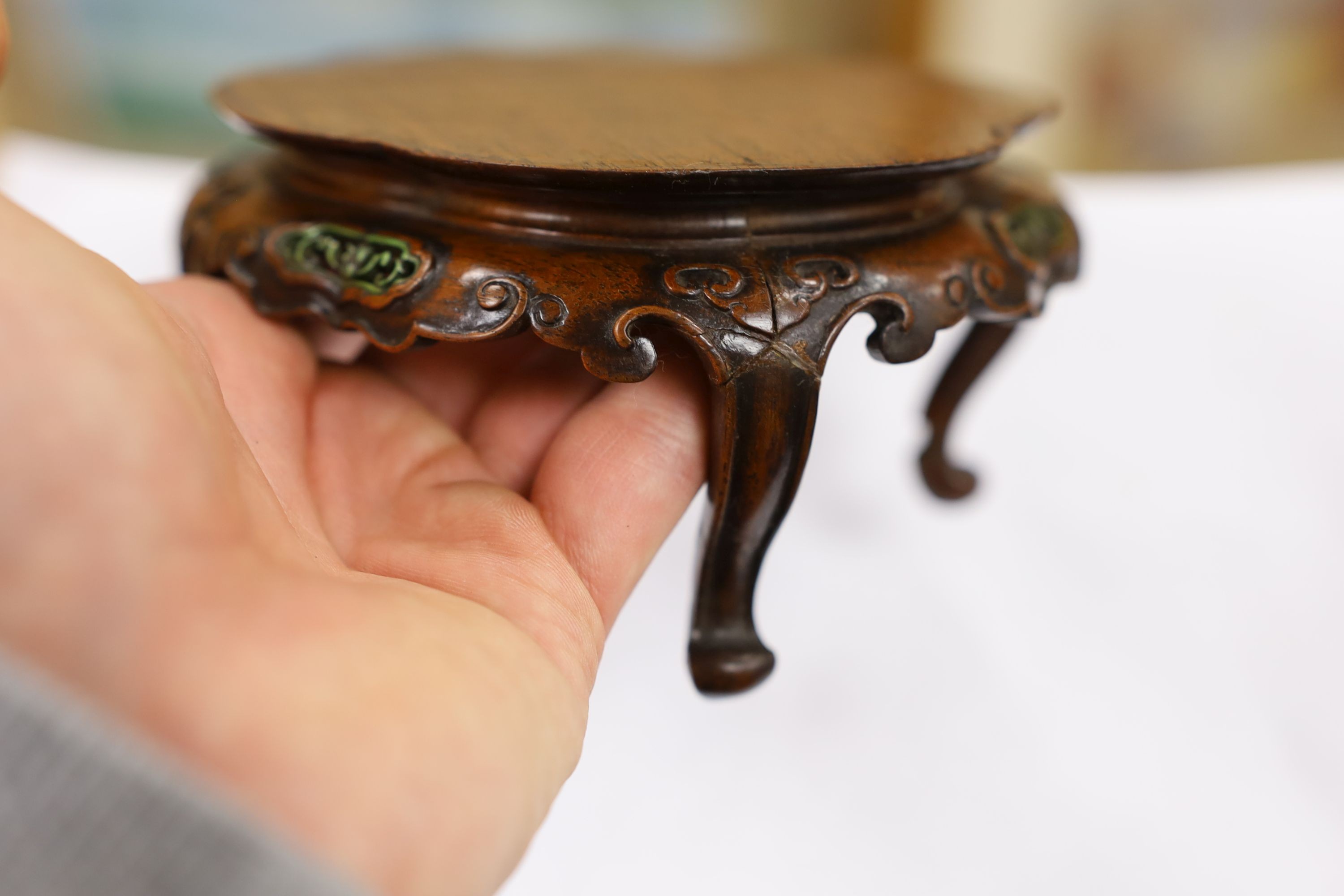 A fine Chinese oval hardwood and green stained Ivory inset stand, Qing dynasty, lacking stretcher, 15 cms wide.